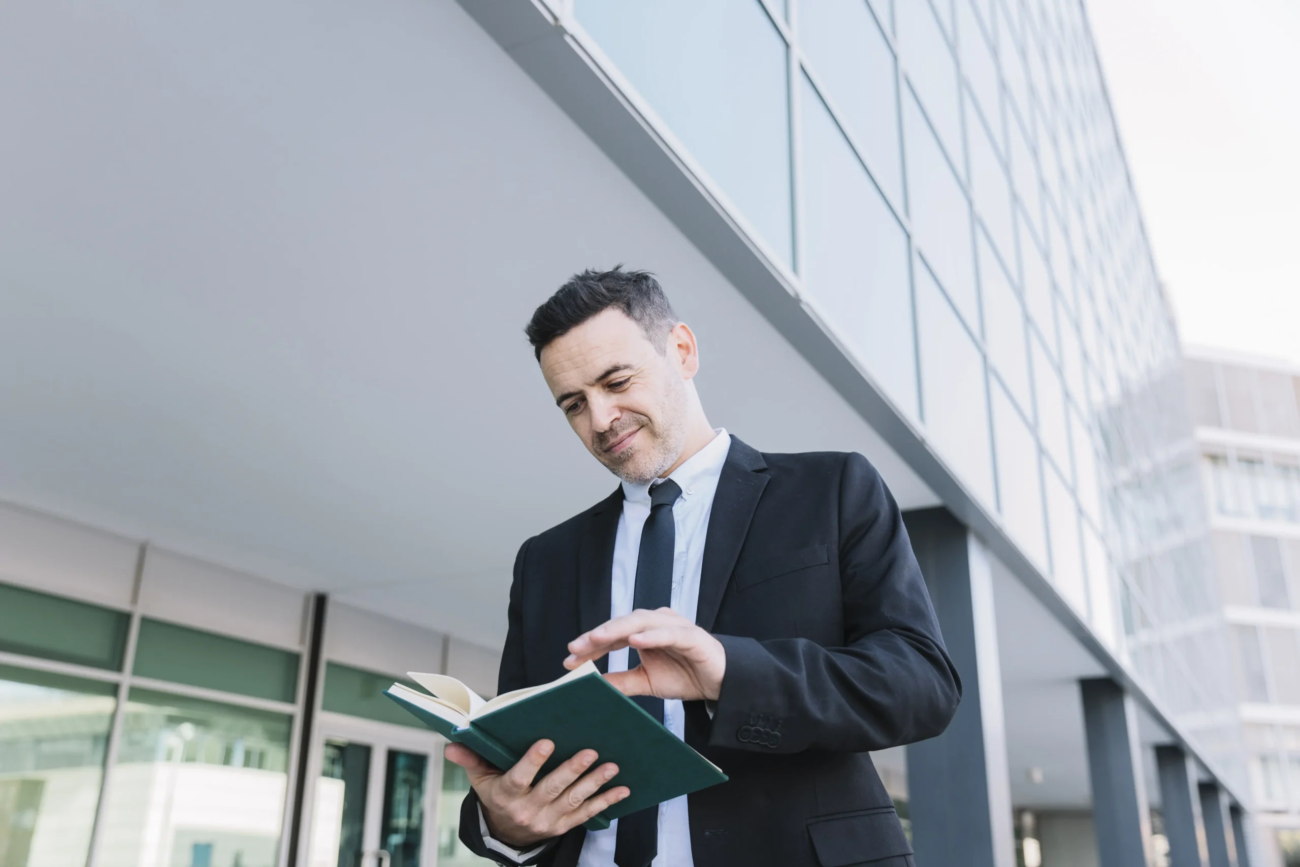 smiling businessman reading