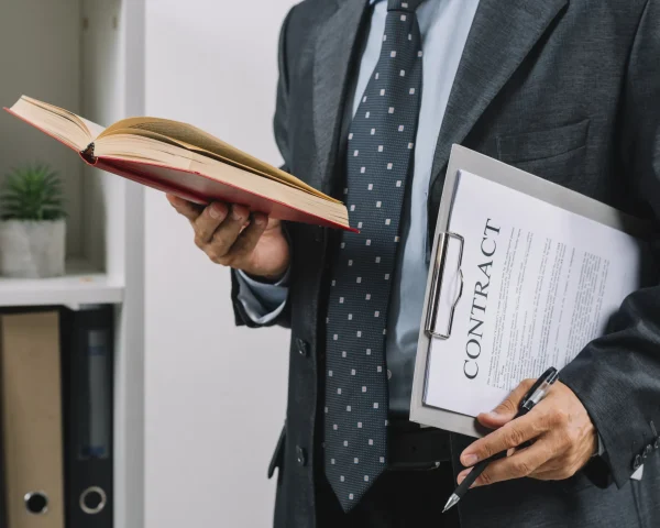 businessman holding book clipboard with contract