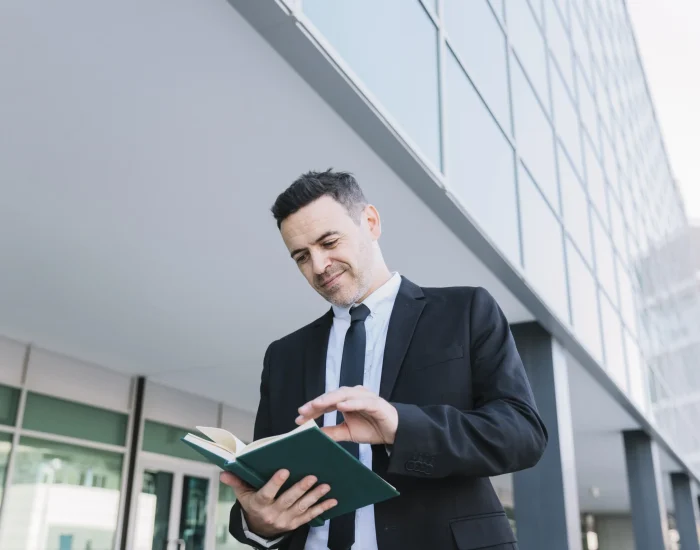smiling businessman reading